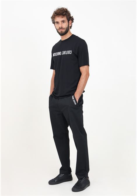 Elegant black men's trousers with logo lettering embroidery MOSCHINO | 242ZR033570201555