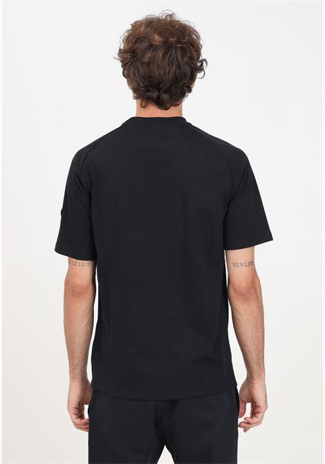 T-shirt a manica corta Oval Patch nera da uomo MOSCHINO | 242ZR071370443555
