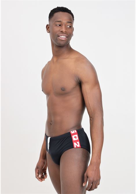 Black men's swim briefs with red and white logoed band on the sides DSQUARED2 | D7B455530002