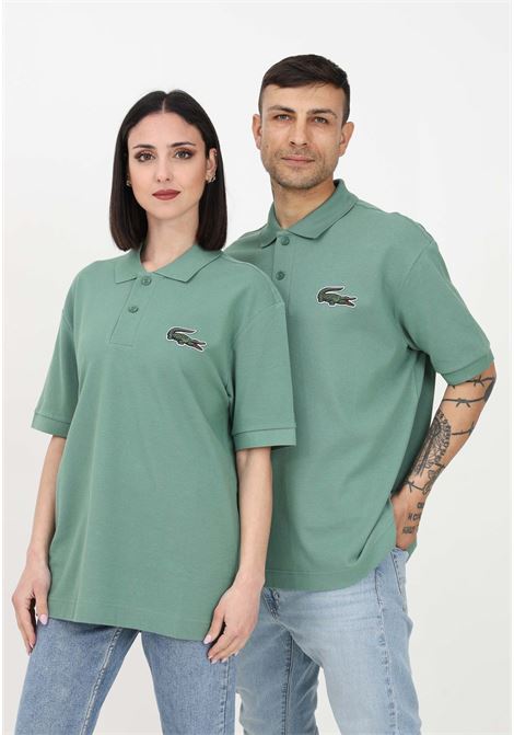 Polo verde per uomo e donna con coccodrillo ricamato sul petto LACOSTE | PH3922KX5