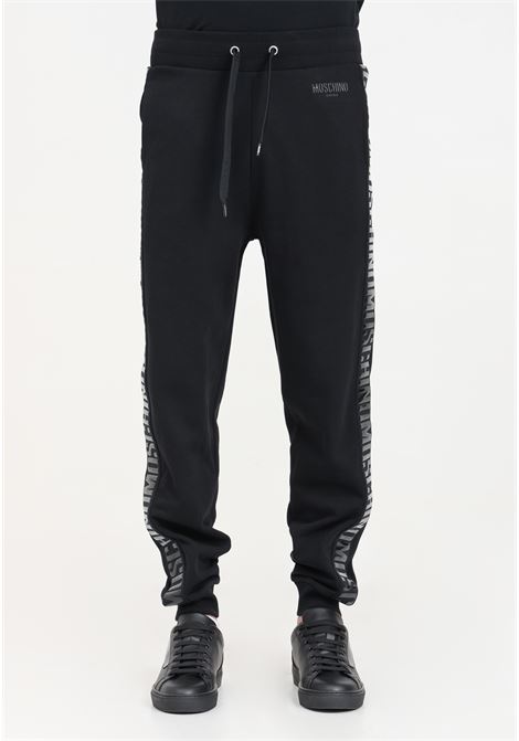 Black men's trousers with tone-on-tone side logo patch MOSCHINO | V671394100555