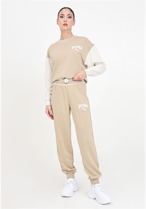 Pantaloni sportivi da donna Puma SQUAD Pants TR beige PUMA | 67790183