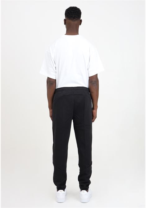 Black sports men's trousers with reflective evostripe logo PUMA | 67899701