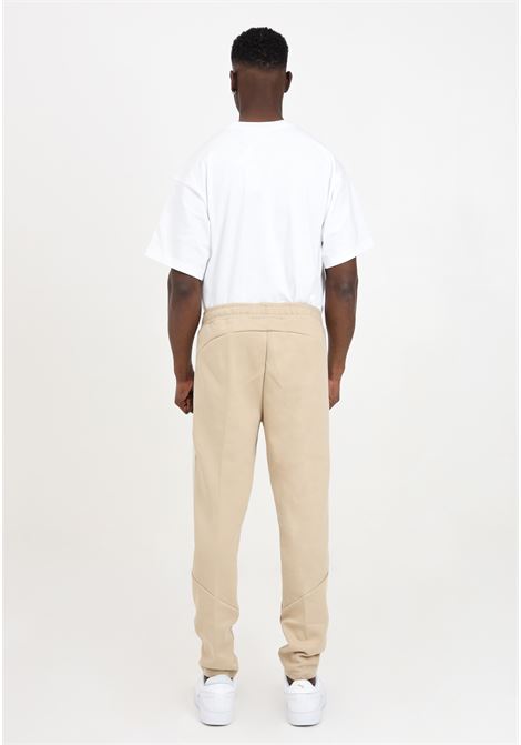 Beige men's sports trousers with reflective evostripe logo PUMA | 67899783