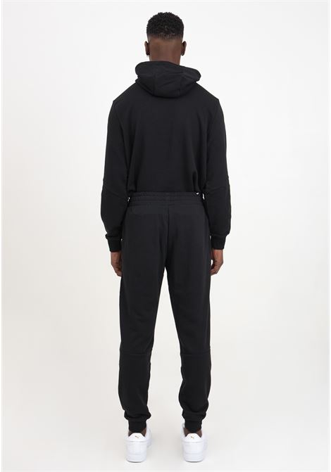 Essentials+ tape sweatpants men's black trousers PUMA | 84738801