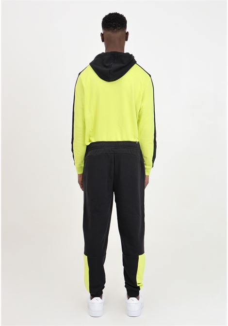 Black men's sports trousers with fluorescent yellow ESS block inserts PUMA | 84800738